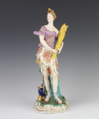 A 19th Century Derby figure of the season Summer with a lady holding a sheaf of corn with a vase and cup at her base, raised on a rococo bottom, 36cm 