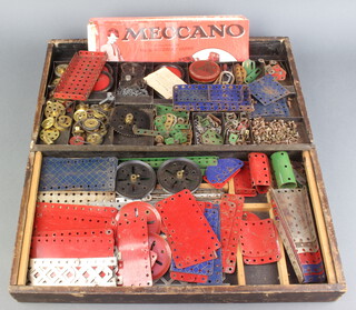 A quantity of red, blue and green Meccano together with instructions for Outfit no.1, no.1a, 2a, 3a and 4a 