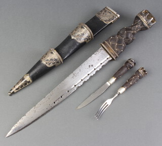 A 19th/20th Century Scottish pipers Dirk the 27cm etched blade marked AF and etched trophies, contained in a black leather and silver mounted scabbard complete with knife and fork  