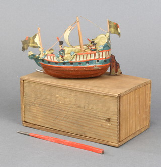 A 19th Century pressed metal model of a galleon 5cm h x 8cm w x 5cm d with prodding stick and wooden case 