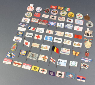 A collection of 70 World War One paper and cloth flag day lapel pins 