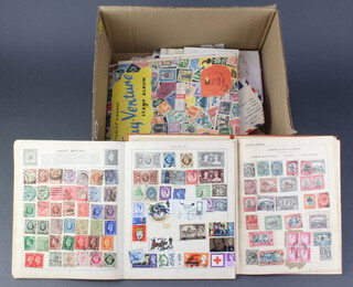 An Olympic album of world stamps, a Treasure Trove stamp album and a Gay Venture stamp album, various loose stamps, stamped envelopes etc  