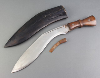 A Kukri with 31cm blade with broad arrow marked India, complete with scabbard (1 skinning knife missing) 
