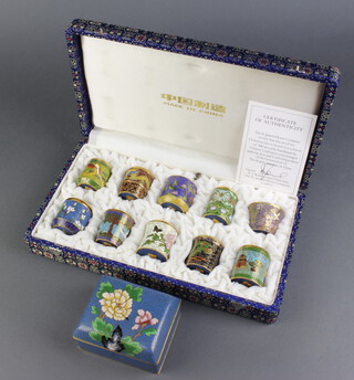 A blue ground rectangular cloisonne enamelled box with floral decoration and hinged lid 5cm h x 9cm w x 8cm d together with 10 limited edition cloisonne jars and covers, cased 