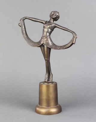 An Art Deco style bronze figure of a standing dancing girl raised on a circular base 33cm h x 22cm w x 4cm d  