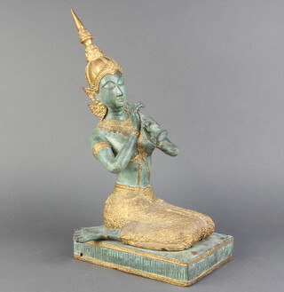A Thai gilt and planished bronze figure of a kneeling female musician 37cm x 20cm x 13cm 