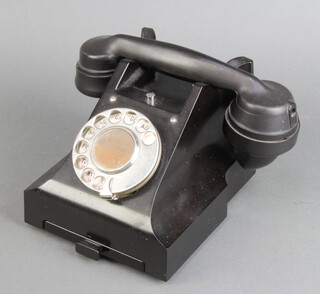 A 312L black Bakelite dial telephone (wire to receiver missing) 