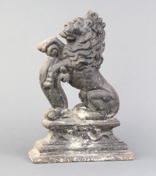 A Victorian cast iron doorstop in the form of a rampant lion 36cm x 25cm x 7cm 