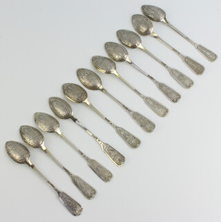 A set of 11 Russian silver teaspoons decorated with flowers, scrolls and buildings, 130 grams 