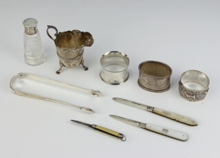 A Victorian silver napkin ring, 2 others, a cream jug and minor items, weighable silver 157 grams 