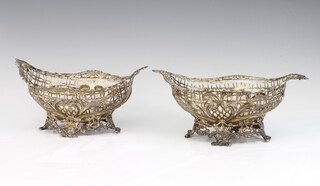 A pair of Victorian pierced and repousse silver deep bowls with floral decoration, London 1892 and 1893, maker William Comyns 19cm, 474 grams