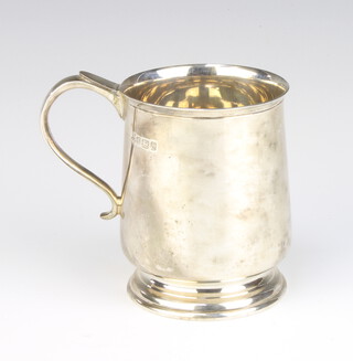 A Georgian design silver baluster jug with simple handle Sheffield 1979, 9cm, 247 grams 
