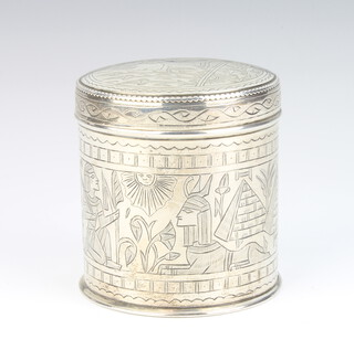 An Egyptian silver engraved cylindrical box decorated with figures, pyramids and camels 8cm, 149 grams 