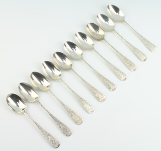 A set of 10 Edwardian silver teaspoons with chased butterflies and flowers Sheffield 1903, 137 grams