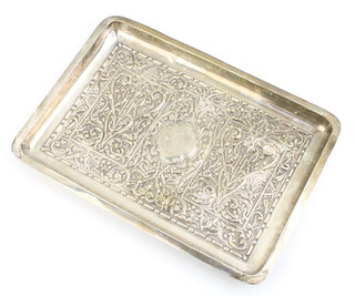 A Victorian repousse silver rectangular dressing table tray with scrolling flowers and engraved cartouche, Chester 1895, 30cm, 442 grams 
