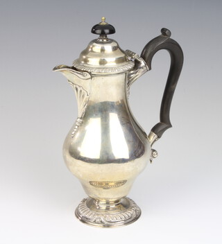 An Edwardian baluster silver coffee pot with ebony mounts, London 1903, maker Daniel and John Welby, 20cm, 364 grams
