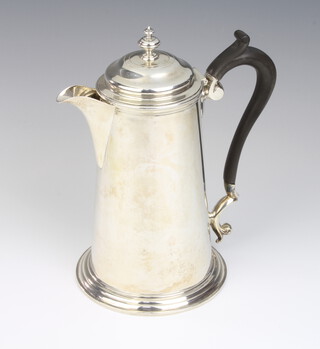 A Georgian style silver hot water jug with ebony handle, Sheffield 1915, 22cm, 599 grams gross 