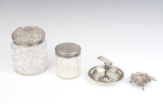 An Edwardian silver ashtray with beaded rim, 45 grams, 2 silver lidded jars and a coin set ashtray 