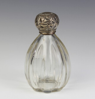 An Edwardian glass scent with repousse silver lid 14cm London 1909 