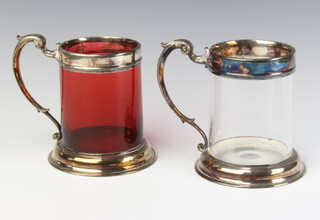 A silver plated mounted ruby glass mug and a clear ditto 