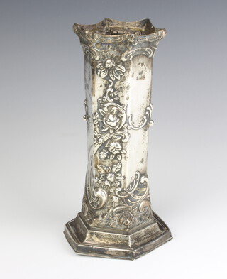 An Edwardian repousse silver octagonal vase decorated with scrolling flowers, Birmingham 1903, 288 grams 