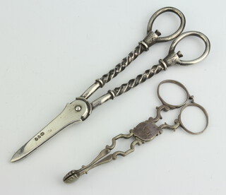 A pair of Victorian silver grape scissors with twist stems, London 1890 maker Edward Hutton and a pair of Georgian silver sugar nips, 148 grams