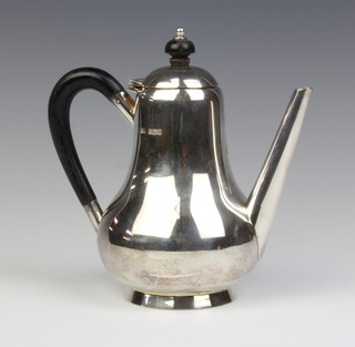 A silver pear shaped coffee pot with ebonised mounts, Sheffield 1927, 469 grams
