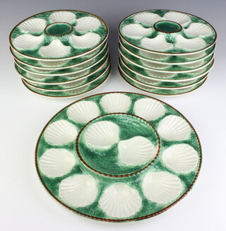 A Victorian style service of oyster plates comprising 12 plates and 1 serving plate 
