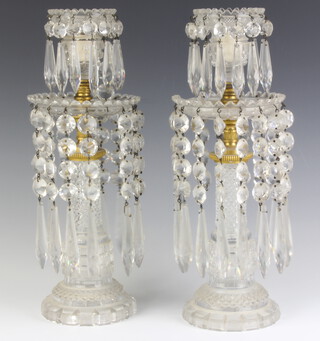 A pair of 19th Century clear glass lustres with faceted drops 34cm
