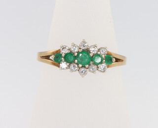 A 9ct yellow gold emerald and diamond ring, size N, 2.5 grams