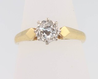 A yellow gold single stone diamond ring size M 