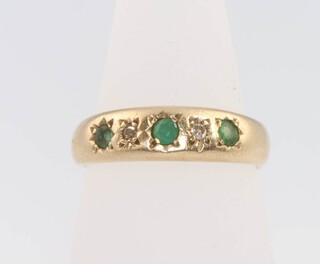 A 9ct yellow gold emerald and diamond ring size K 1/2, 2.8 grams