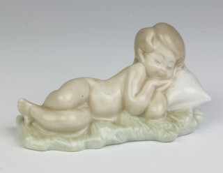 A Lladro figure of a child sleeping on a pillow 9cm 