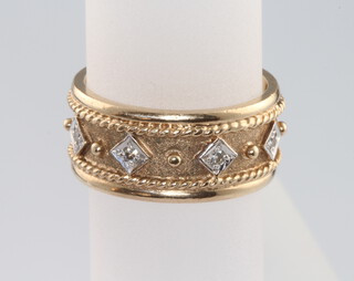 A 9ct yellow gold diamond set etruscan style ring, size N 1/2, 7.2 grams 