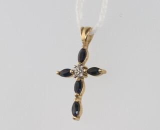 A 9ct yellow gold sapphire and diamond cross pendant 0.7 grams, 20mm