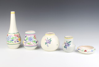 A Poole baluster vase decorated with flowers 10cm, a ditto 12cm another 13cm, a bottle vase 27cm and a dish 11cm 