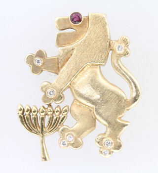 A 14ct yellow gold ruby and diamond set lion brooch, 45mm, 14.9 grams 