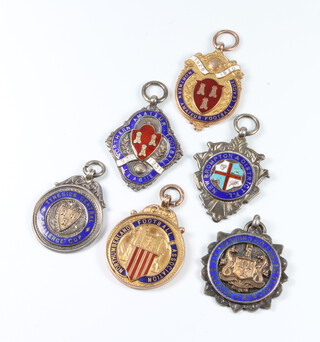 Of football interest, Two 9ct yellow gold enamelled sports fobs - Northern Amateur Football League 1929/30 and Northumberland Football Association 1929/30, 4 silver ditto - Tyneside Central Challenge Cup 1926/27, Northern Amateur Football League 1930/31, New Brompton and District Football League 1933/34 and Newcastle District United Churches Association Football Club League together with fixtures 1927/28. 1928/29. 1929/30. 1930/31. and 1931/32, together with press clippings, Army Record of Service and pay book to J C Bennett, gold weight 16.8 grams, silver weight 48 grams