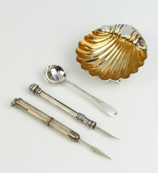 A Victorian style silver shell salt and spoon together with two toothpicks