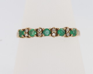 A 9ct yellow gold emerald and diamond ring, size R, 1.6 grams