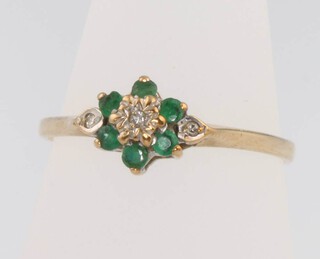 A 9ct yellow gold emerald and diamond cluster ring 1.3 grams