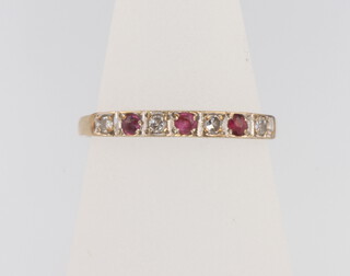 A 9ct yellow gold ruby and diamond ring size L 1.3 grams