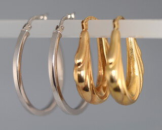 A pair of white gold hoop earrings and 2 pairs of yellow gold ditto 5.6 grams