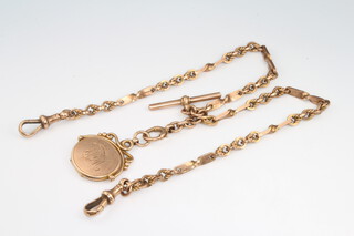 A 9ct rose gold fancy link Albert with matching T-Bar and 2 clasps with a 9ct swivel fob locket 38.3 grams