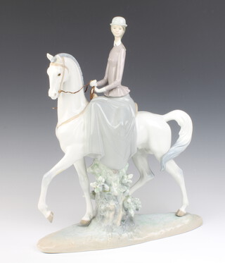 A Lladro figure of a lady on horseback 45cm 