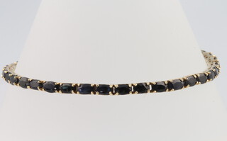 A 14ct yellow gold sapphire bracelet 19cm, 10.5 grams  
