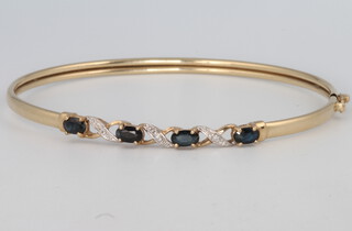A 9ct yellow gold sapphire and diamond bangle 4.1 grams