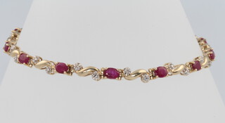 A 9ct yellow gold ruby and diamond bracelet 18cm, 5.2 grams
