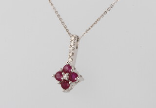 An 18ct white gold ruby and diamond pendant on a ditto chain 2.8 grams 