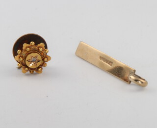 An Edwardian 15ct yellow gold diamond set stud and a 9ct diamond set pendant 